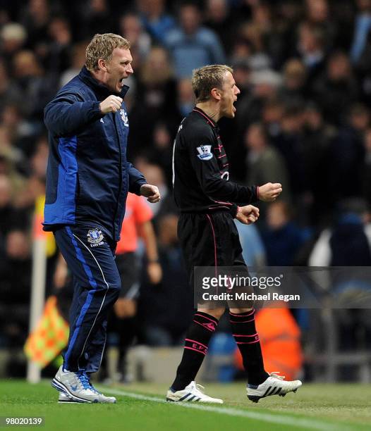Everton manager David Moyes celebrates the Everton's second goal with Phil Neville during the Barclays Premiership match between Manchester City and...