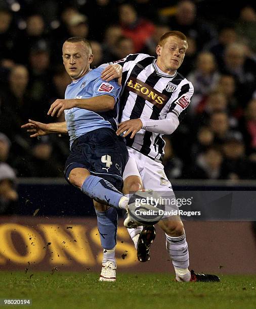 Sammy Clingan of Coventry City is tackled by Ben Watson during the Coca-Cola Championship match between West Bromwich Albion and Coventry City at The...