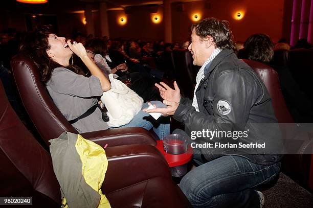 Actress Carolina Vera Squella and actor Sven Martinek make fun while attending the premiere of 'Haltet Die Welt an' at cinema Astor Film Lounge on...