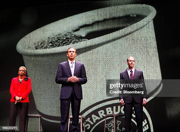 Paula Boggs, left, executive vice president, general counsel, and secretary of Starbucks Corp., left, Howard Schultz, chief executive officer,...