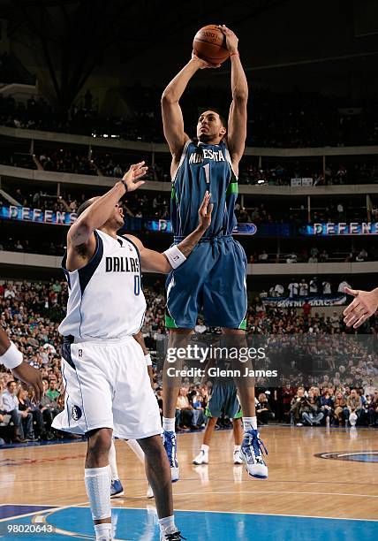 Ryan Hollins of the Minnesota Timberwolves takes a jump shot against Shawn Marion of the Dallas Mavericks during the game at the American Airlines...