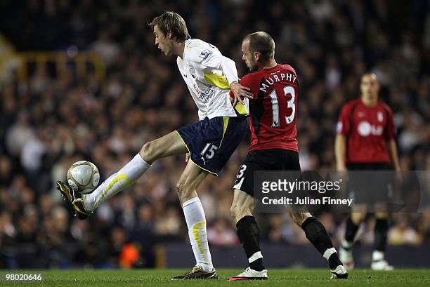 Peter Crouch of Spurs holds off Danny Murphy of Fulham during the FA Cup Quarter Final Replay match between Tottenham Hotspur and Fulham at White...