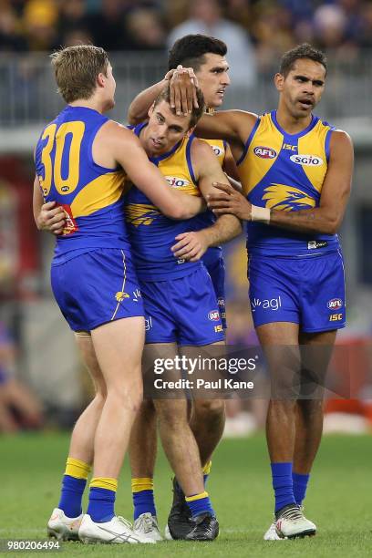 Jamie Cripps of the Eagles is congratulated by Jackson Nelson and Lewis Jetta of the Eagles after kicking the teams second goal late in the third...