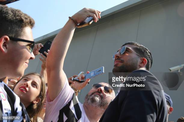 New Juventus signing Emre Can poses for a selfie with his fan Efollowing his arrival in Turin on June 21, 2018 in Turin, Italy.
