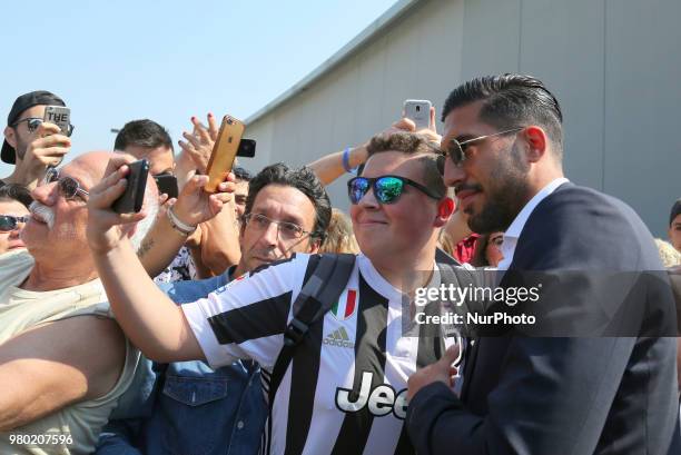 New Juventus signing Emre Can poses for a selfie with his fan Efollowing his arrival in Turin on June 21, 2018 in Turin, Italy.