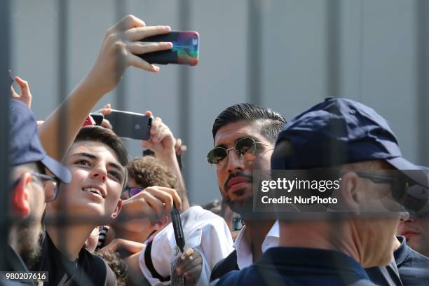 New Juventus signing Emre Can poses for a selfie with his fan Efollowing his arrival in Turin on June 21, 2018 in Turin, Italy.