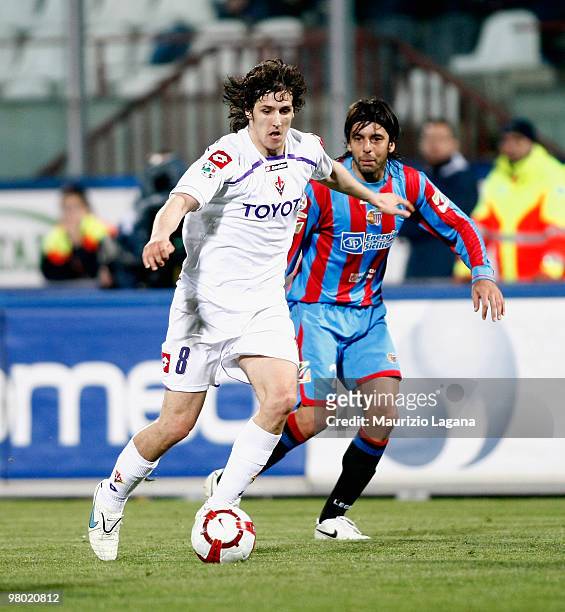 Jorge Martinez of Catania Calcio battles for the ball with Stevan Jovetic of ACF Fiorentina during the Serie A match between Catania Calcio and ACF...