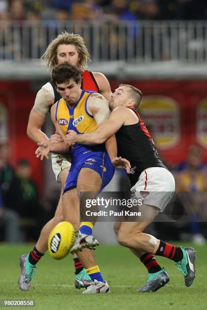 Andrew Gaff of the Eagles gets tackled by Devon Smith of the Bombers during the round 14 AFL match between the West Coast Eagles and the Essendon...