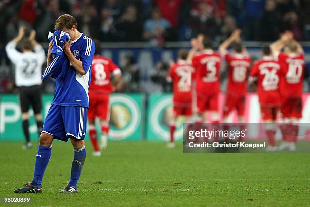 Benedikt Hoewedes of Schalke looks dejected after losing 0-1 after extra time the DFB Cup semi final match between FC Schalke 04 and FC Bayern...