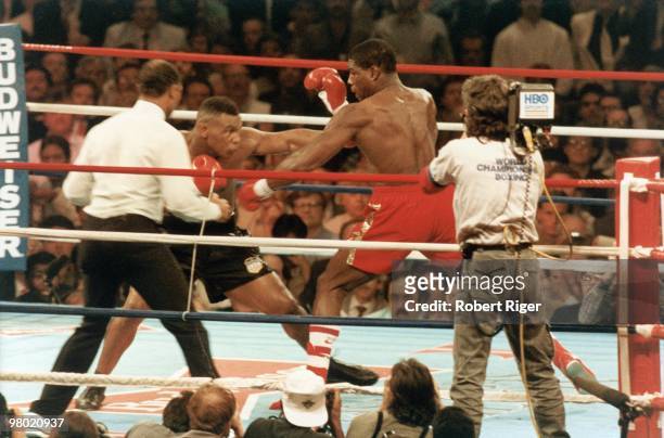 Mike Tyson fights against Frank Bruno during the heavyweight championship at Hilton Hotel on February 25, 1989 in Las Vegas, Nevada.