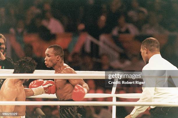 Sugar Ray Leonard fights against Roberto Duran during the Super Middleweight Title fight at Mirage Hotel & Casino on December 7, 1989 in Las Vegas,...