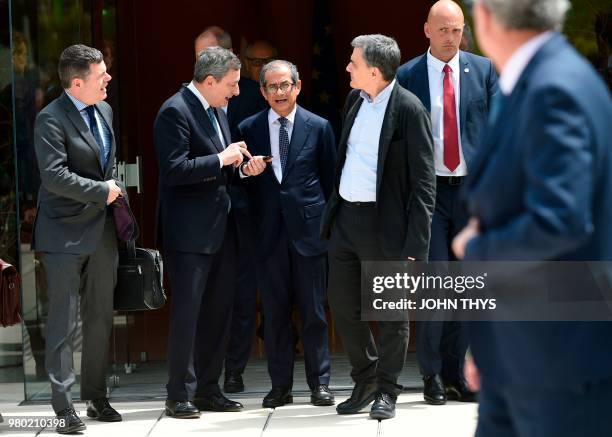 Ireland's Public Expenditure and Reform Minister, Paschal Donohoe, talks with Greek Finance Minister Euclid Tsakalotos , President of the European...