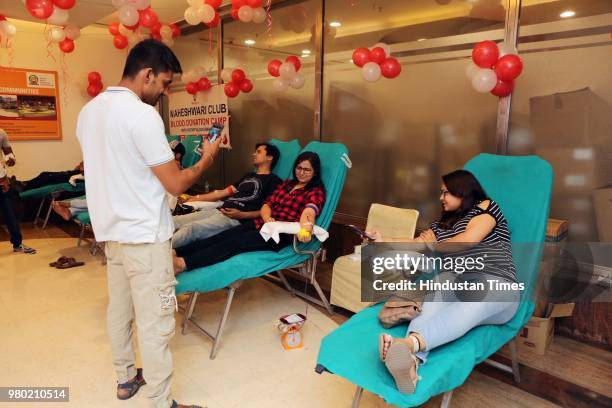 People donate blood during a blood donation camp organised by Aarone Group along with Select Citywalk, one of the most popular shopping malls in...