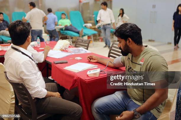 People donate blood during a blood donation camp organised by Aarone Group along with Select Citywalk, one of the most popular shopping malls in...