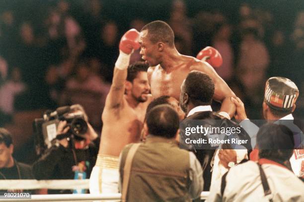 Sugar Ray Leonard and Roberto Duran celebrate following the Super Middleweight Title fight at Mirage Hotel & Casino on December 7, 1989 in Las Vegas,...
