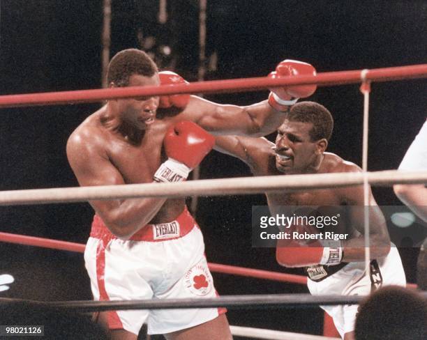Michael Spinks throws a right to the head against Larry Holmes during the heavyweight championship at Riviera Hotel & Casino on September 21, 1985 in...
