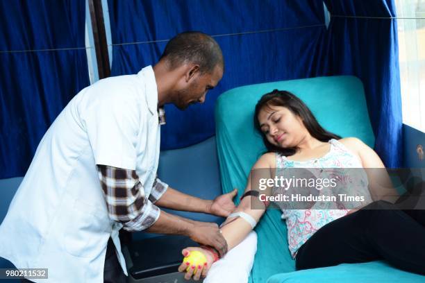 Girl donates blood during a blood donation camp organised by Aarone Group along with Select Citywalk, one of the most popular shopping malls in...