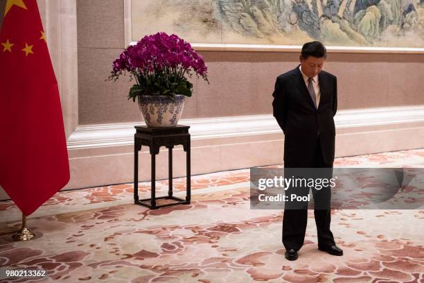 China's President Xi Jinping waits for the arival of Papua New Guinea Prime Minister Peter O'Neill prior to a meeting at the Diaoyutai State...