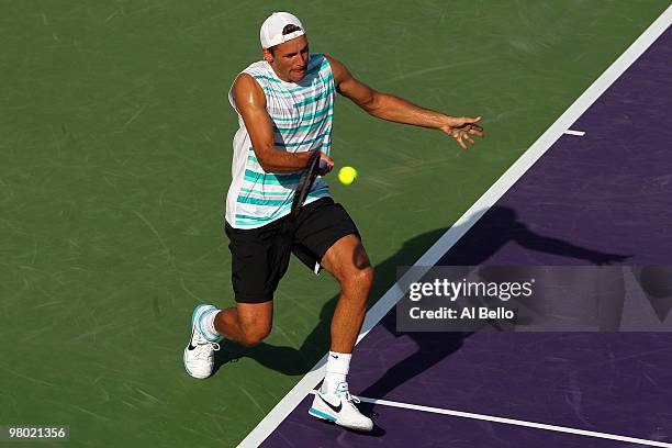 Lukasz Kubot of Poland returns a shot against David Nalbandian of Argentina during day two of the 2010 Sony Ericsson Open at Crandon Park Tennis...