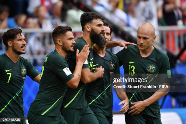 Mile Jedinak of Australia celebrates with team mates Aaron Mooy, Robbie Kruse, Mathew Leckie and Joshua Risdon after scoring his team's first goal...