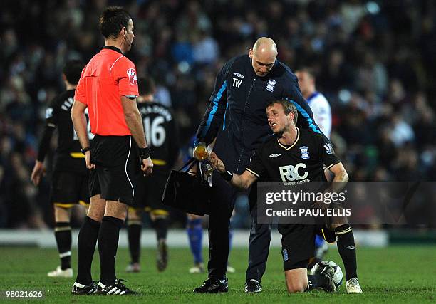 Birmingham City's English midfielder Lee Bowyer appeals to Referee Mark Clattenburg after he was fouled against Blackburn Rovers during their English...