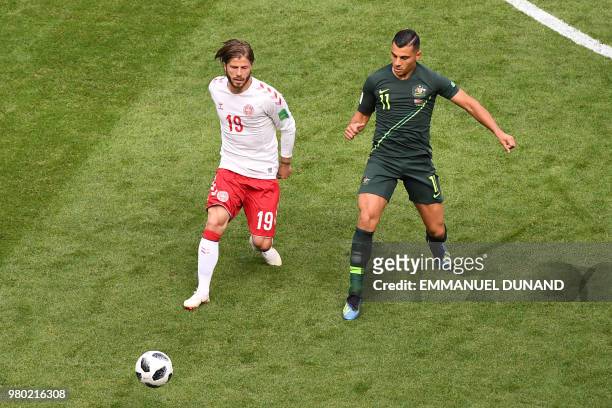 Denmark's midfielder Lasse Schone vies for the ball with Australia's forward Andrew Nabbout during the Russia 2018 World Cup Group C football match...