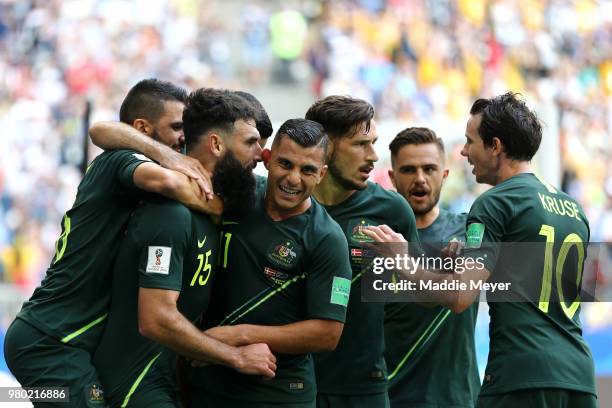 Mile Jedinak of Australia celebrates with team mates Andrew Nabbout, Mathew Leckie, Robbie Kruse and Mark Milligan after scoring his team's first...