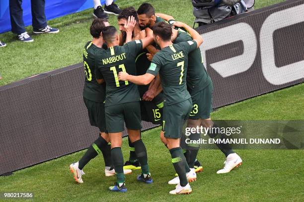 Australia's midfielder Mile Jedinak celebrates with teammates after scoring a penalty kick during the Russia 2018 World Cup Group C football match...