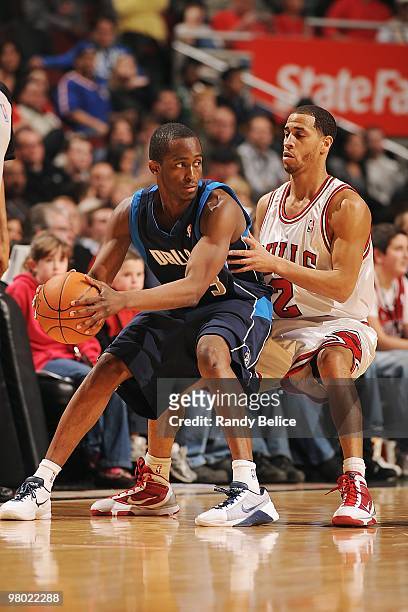 Rodrique Beaubois of the Dallas Mavericks handles the ball against Jannero Pargo of the Chicago Bulls during the game on March 6, 2010 in Chicago,...