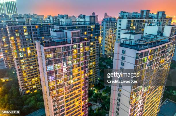 illuminated residential building - xie liyao stock pictures, royalty-free photos & images