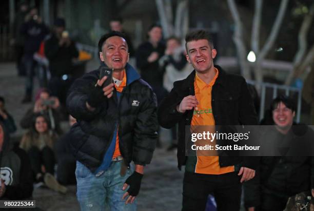 Australian fans react as Mile Jedinak of the Socceroos scores the first goal for Australia as they watch the FIFA World Cup match between the...