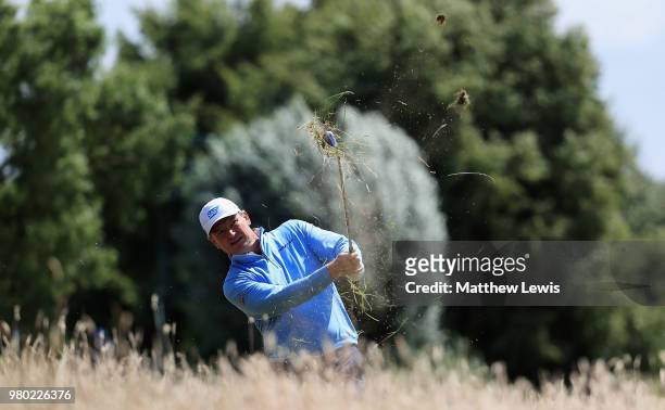 Ernie Els of South Africa plays out of the rough on the 2nd hole during day one of the BMW International Open at Golf Club Gut Larchenhof on June 21,...
