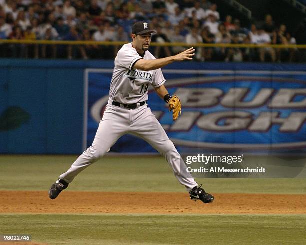 Florida Marlins infielder Mike Lowell assists on an out against the Tampa Bay Devil Rays June 26, 2004. The Rays won 6 to 4.