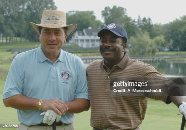 Johnny Bench and Joe Morgan play in golf tournament before 2004 Baseball Hall of Fame induction ceremonies July 25, 2004 in Cooperstown, New York.