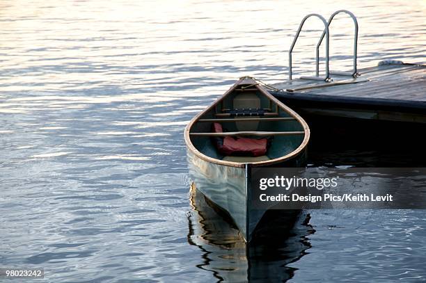 canoe at a dock, lake of the woods, ontario, canada - livit fotografías e imágenes de stock