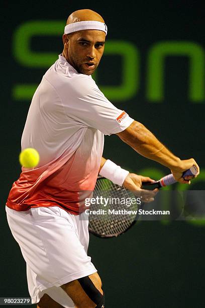 James Blake of the United States returns a shot against Filip Krajinovic of Serbia during day two of the 2010 Sony Ericsson Open at Crandon Park...