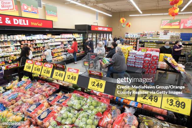 Shoppers look at the selections at Grocery Outlet Bargain Market on Beach Blvd. In Huntington Beach, CA during the opening of the store on Thursday,...