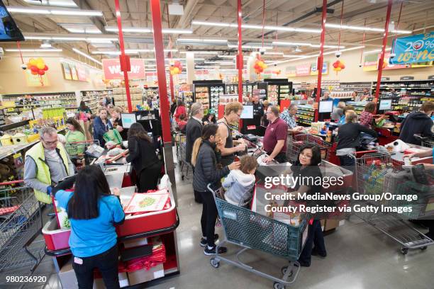 Shoppers check out during the opening of the Grocery Outlet Bargain Market on Beach Blvd. In Huntington Beach, CA on Thursday, March 29, 2018. The...