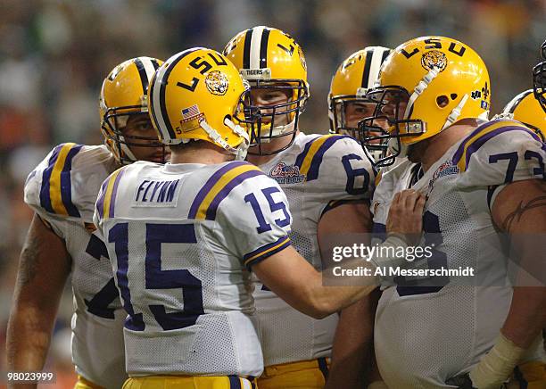 Quarterback Matt Flynn calls a play in the huddle against the University of Miami in the 2005 Chick-fil-A Peach Bowl at the Georgia Dome in Atlanta,...