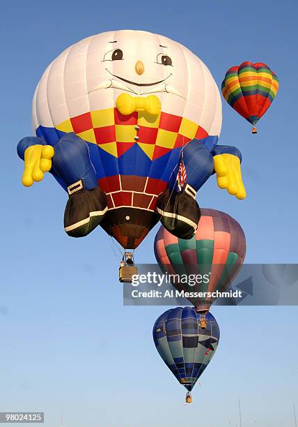 Humpty Dumpty flies overhead during a morning ascent at the Albuquerque International Balloon Fiesta in Albuquerque, New Mexico on October 8, 2005.