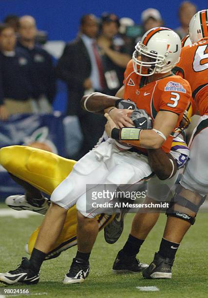 University of Miami quarterback Kyle Wright is sacked by the LSU defense during the 2005 Chick-fil-A Peach Bowl on December 30, 2005 at the Georgia...