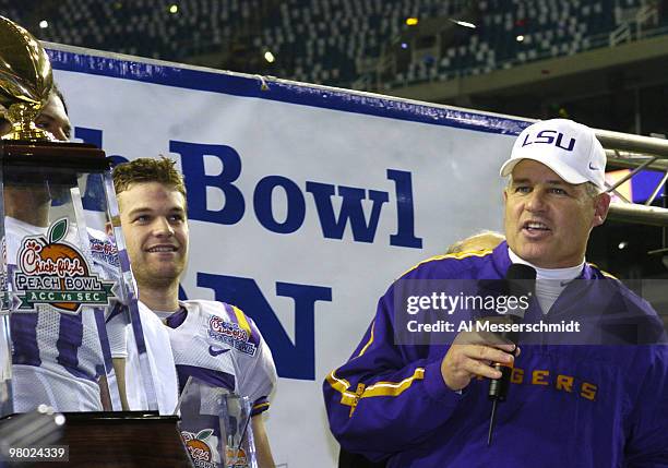 Coach Les Miles talks to fans after defeating the University of Miami in the 2005 Chick-fil-A Peach Bowl at the Georgia Dome in Atlanta, Georgia on...