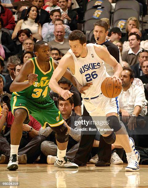 Hedo Turkoglu of the Toronto Raptors makes his move trying to get past C.J. Miles of the Utah Jazz during a game on March 24, 2010 at the Air Canada...