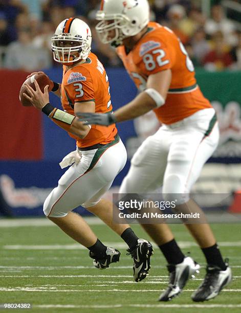 University of Miami quarterback Kyle Wright sets to pass at the 2005 Chick-fil-A Peach Bowl at the Georgia Dome in Atlanta, Georgia on December 30,...