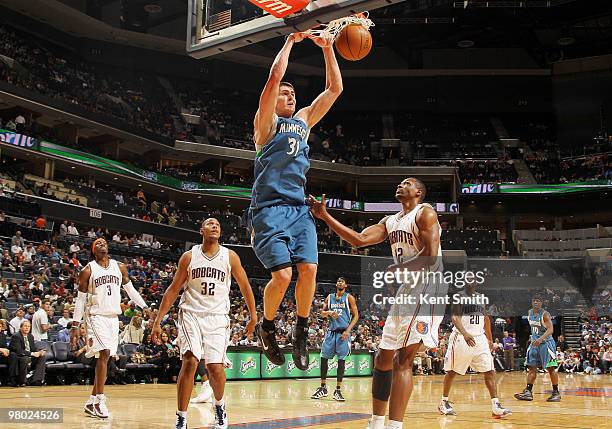 Darko Milicic of the Minnesota Timberwolves dunks against Theo Ratliff of the Charlotte Bobcats on March 24, 2010 at the Time Warner Cable Arena in...