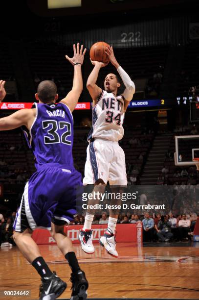 Devin Harris of the New Jersey Nets shoots against Francisco Garcia of the Sacramento Kings during the game on March 24, 2010 at the Izod Center in...