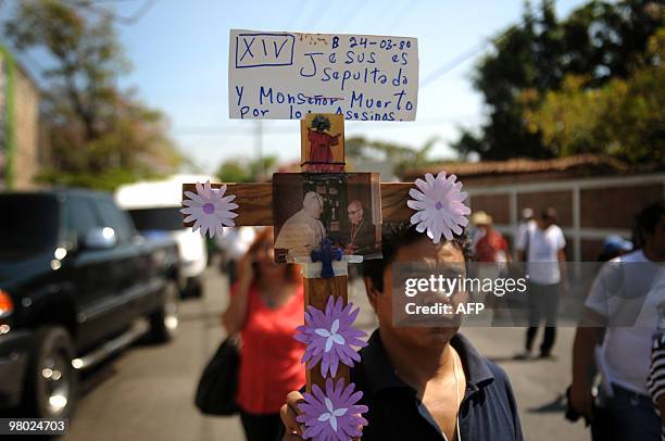 People march on March 24, 2010 in San Salvador during the commemoration of the 30th anniversary of the murder of Monsignor Oscar Arnulfo Romero, who...