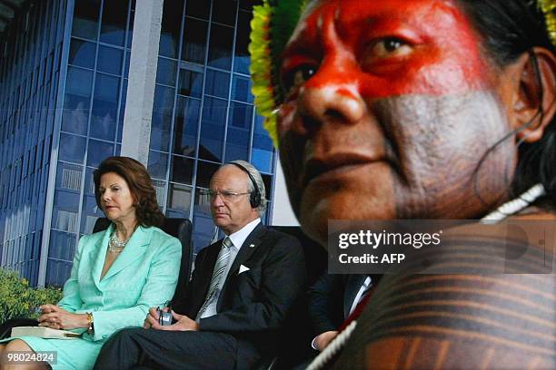King Carl XVI Gustaf and Queen Silvia hold a meeting with a Brazilian indigenous chief, at the Justice Palace in Brasilia, on March 24, 2010. King...