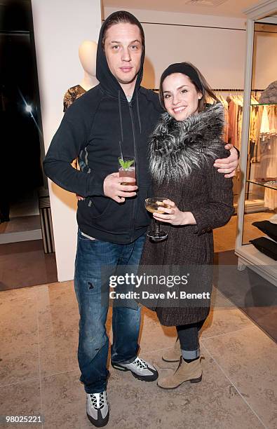 Tom Hardy and Charlotte Riley arrive at the opening of designer Malene Birger's first UK boutique on March 24, 2010 in London, England.