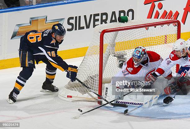 Patrick Kaleta of the Buffalo Sabres fails to get the puck past Carey Price and Tomas Plekanec of the Montreal Canadiens at HSBC Arena on March 24,...